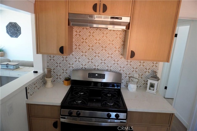 3565 Lashbrook Ave, Rosemead, CA 91770 - kitchen featuring stainless steel range with gas stovetop, under cabinet range hood, decorative backsplash, and light stone counters