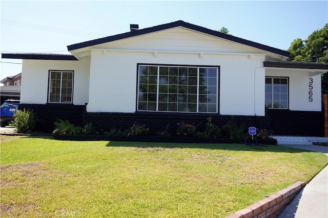 3565 Lashbrook Ave, Rosemead, CA 91770 - view of side of home featuring brick siding and a lawn