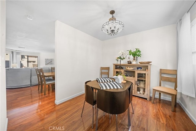 2608 W Grand Ave Unit B, Alhambra, CA 91801 - dining space with a chandelier and wood finished floors