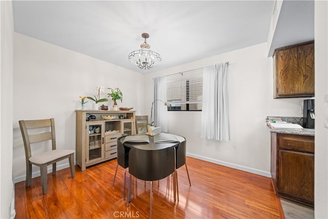 2608 W Grand Ave Unit B, Alhambra, CA 91801 - dining area featuring a chandelier and wood finished floors
