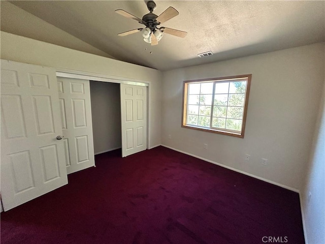 30134 Enchanted Way, Running Springs, CA 92382 - unfurnished bedroom featuring a closet, lofted ceiling, dark colored carpet, and ceiling fan