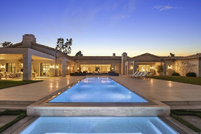 17845 Via De Fortuna, Rancho Santa Fe, CA 92067 - pool at dusk featuring a patio, an outdoor pool, and outdoor lounge area