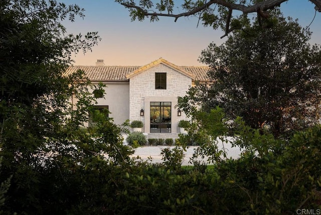 17845 Via De Fortuna, Rancho Santa Fe, CA 92067 - view of front of house featuring a tiled roof, stone siding, and stucco siding
