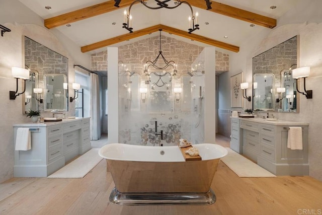 17845 Via De Fortuna, Rancho Santa Fe, CA 92067 - full bath featuring wood finished floors, a chandelier, a soaking tub, and two vanities
