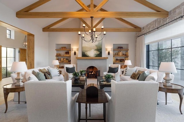 17845 Via De Fortuna, Rancho Santa Fe, CA 92067 - living room with beamed ceiling, a chandelier, high vaulted ceiling, a warm lit fireplace, and light colored carpet