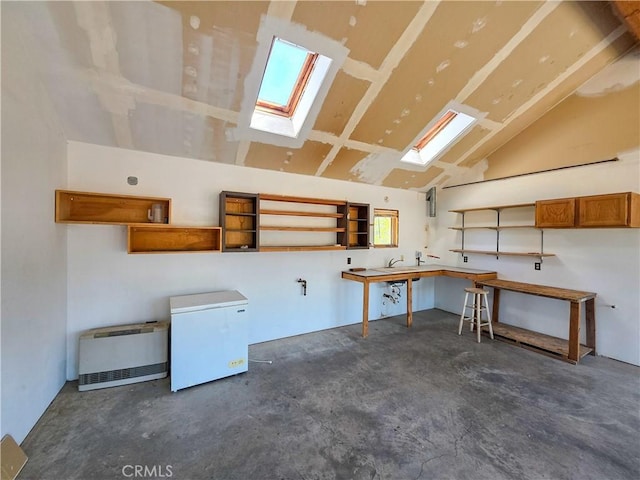 7022 Quarry Rd, Weed, CA 96094 - garage with white refrigerator, a workshop area, and heating unit