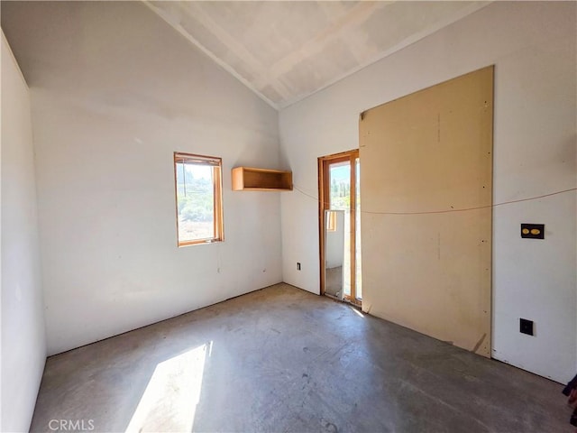 7022 Quarry Rd, Weed, CA 96094 - spare room featuring concrete floors, healthy amount of natural light, and vaulted ceiling