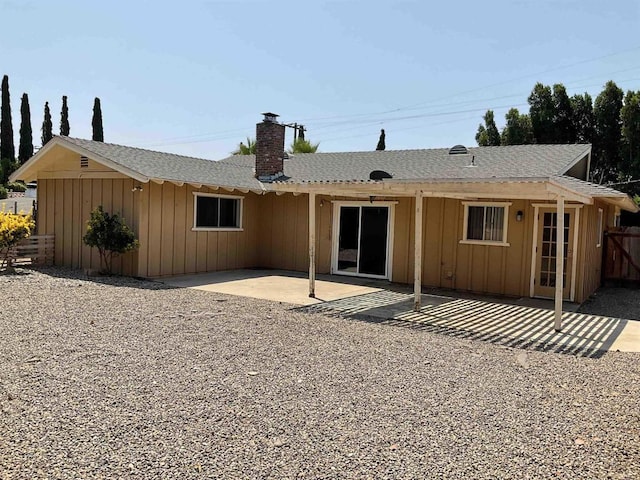 1110 E Alvarado St, Fallbrook, CA 92028 - rear view of house featuring a chimney, board and batten siding, and a patio area