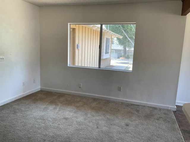 1110 E Alvarado St, Fallbrook, CA 92028 - unfurnished room featuring baseboards and dark carpet