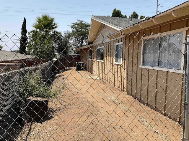 1110 E Alvarado St, Fallbrook, CA 92028 - view of side of property featuring a fenced backyard, a shingled roof, and a patio