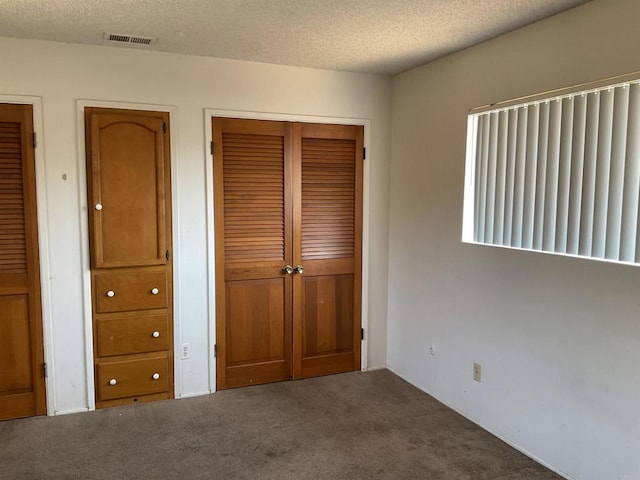 1110 E Alvarado St, Fallbrook, CA 92028 - unfurnished bedroom with carpet floors, a closet, and a textured ceiling