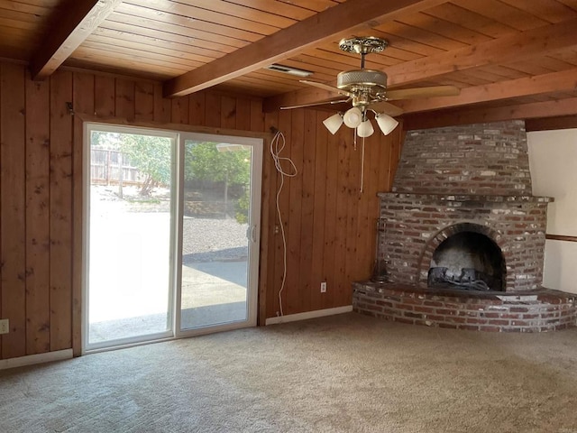 1110 E Alvarado St, Fallbrook, CA 92028 - unfurnished living room with a wood ceiling with exposed beams, wooden walls, a fireplace, carpet floors, and a ceiling fan