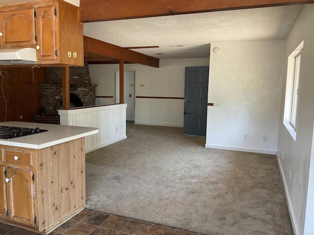 1110 E Alvarado St, Fallbrook, CA 92028 - kitchen with black electric stovetop, range hood, dark colored carpet, open floor plan, and a textured ceiling