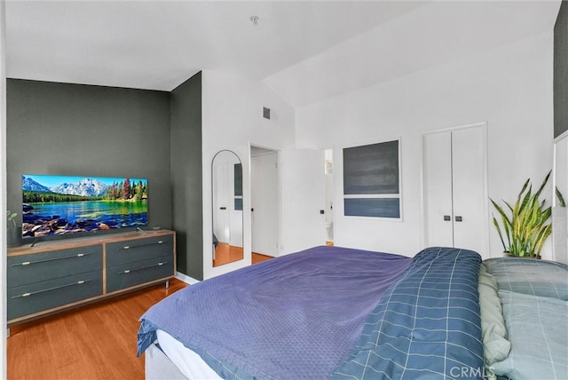 118 Gallery Way, Tustin, CA 92782 - bedroom featuring wood finished floors, high vaulted ceiling, and a closet