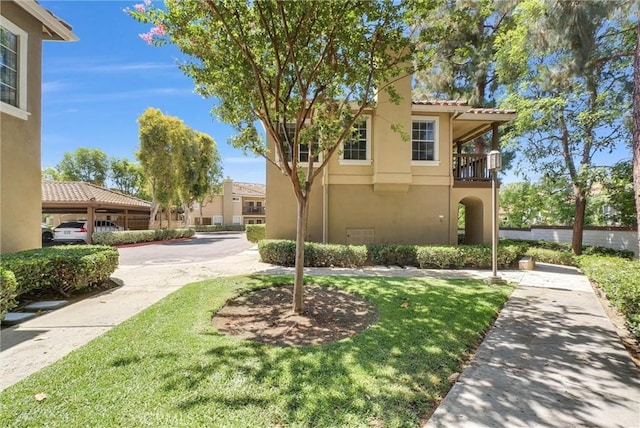 118 Gallery Way, Tustin, CA 92782 - view of front facade featuring stucco siding, a tiled roof, and a front yard
