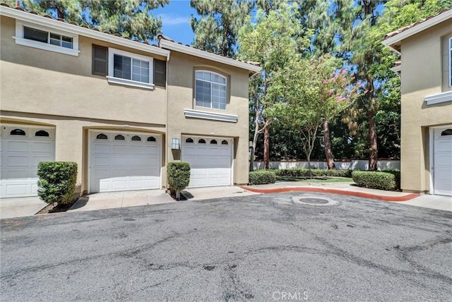 118 Gallery Way, Tustin, CA 92782 - view of front of house with stucco siding and a garage