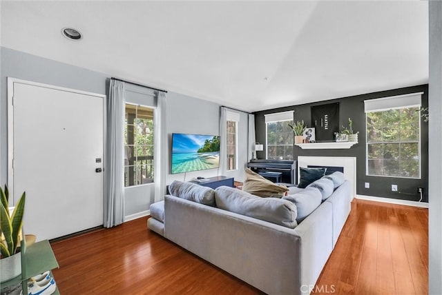 118 Gallery Way, Tustin, CA 92782 - living area with wood finished floors, a fireplace, and vaulted ceiling
