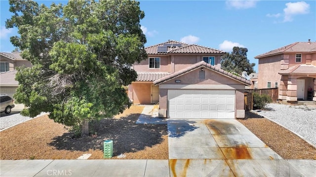 14094 Gray Ln, Victorville, CA 92394 - view of front of property with stucco siding, concrete driveway, a tile roof, and a garage
