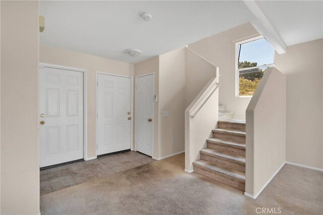 14094 Gray Ln, Victorville, CA 92394 - carpeted entrance foyer featuring baseboards and stairway