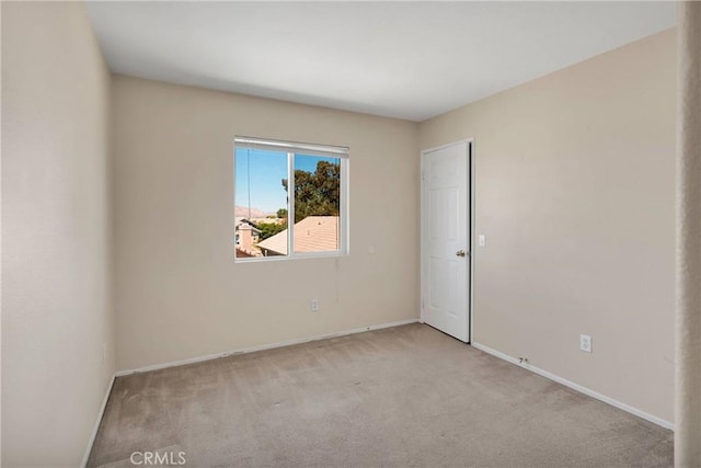 14094 Gray Ln, Victorville, CA 92394 - spare room featuring carpet floors and baseboards