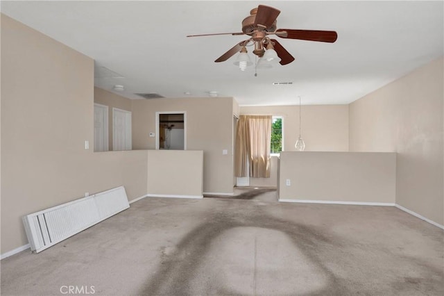 14094 Gray Ln, Victorville, CA 92394 - unfurnished living room with ceiling fan, carpet, and radiator