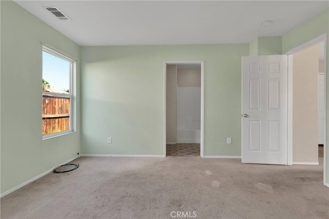 14094 Gray Ln, Victorville, CA 92394 - unfurnished bedroom featuring carpet flooring and multiple windows