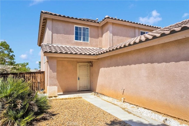 14094 Gray Ln, Victorville, CA 92394 - entrance to property featuring a tile roof and stucco siding