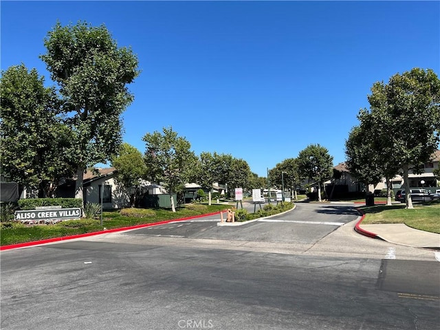23240 Orange Ave Unit 8, Lake Forest, CA 92630 - view of asphalt street with curbs and a residential view
