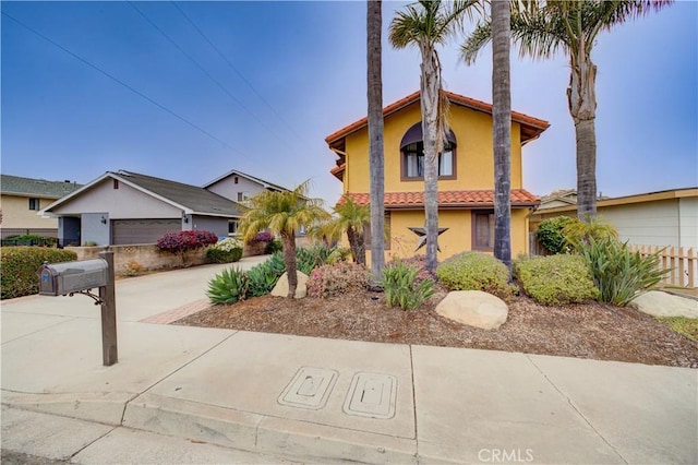 375 N 6th St, Grover Beach, CA 93433 - mediterranean / spanish home featuring a tiled roof, stucco siding, and concrete driveway