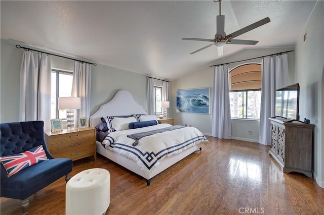 375 N 6th St, Grover Beach, CA 93433 - bedroom with multiple windows, vaulted ceiling, wood finished floors, and a ceiling fan