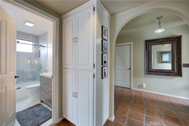 375 N 6th St, Grover Beach, CA 93433 - hallway with arched walkways and tile patterned flooring