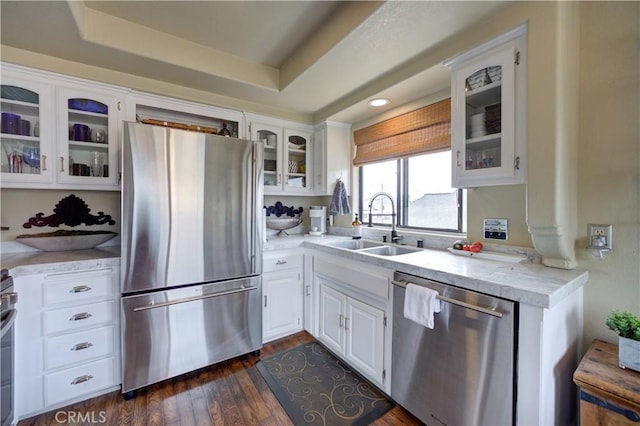 375 N 6th St, Grover Beach, CA 93433 - kitchen featuring appliances with stainless steel finishes, white cabinetry, a raised ceiling, glass insert cabinets, and recessed lighting