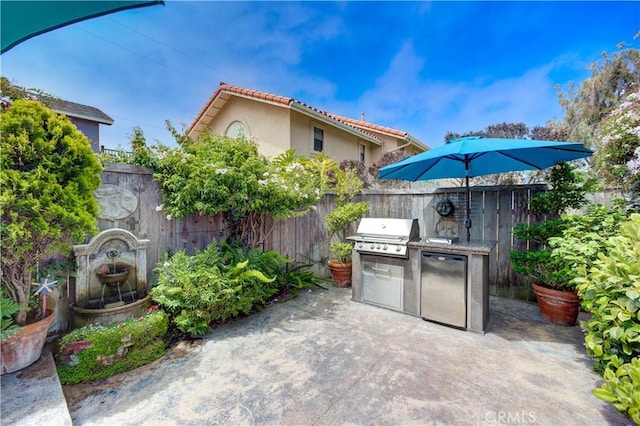 375 N 6th St, Grover Beach, CA 93433 - view of patio featuring an outdoor kitchen and concrete driveway