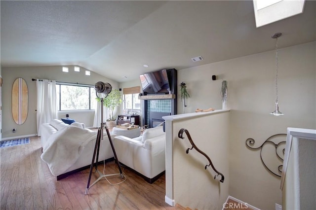 375 N 6th St, Grover Beach, CA 93433 - living room with vaulted ceiling, wood finished floors, and a skylight