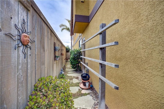 375 N 6th St, Grover Beach, CA 93433 - view of side of home featuring stucco siding