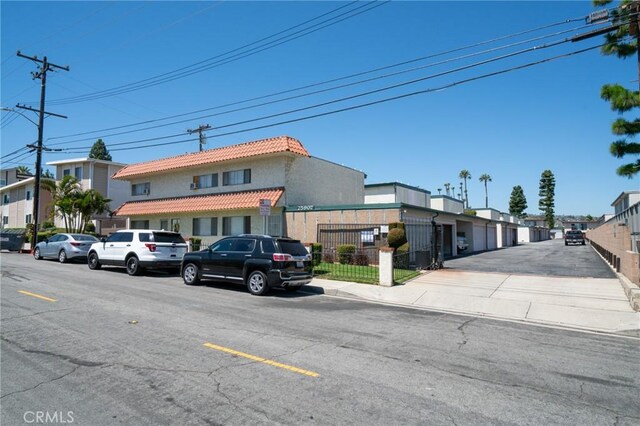 25907 Oak St, Lomita, CA 90717 - view of asphalt street with sidewalks, curbs, and a residential view