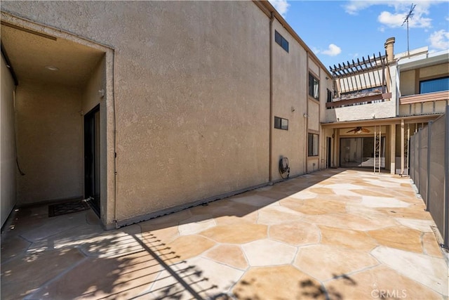 12355 Chandler Blvd Unit 101, Valley Village, CA 91607 - view of side of property with stucco siding and a patio area