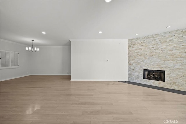 12355 Chandler Blvd Unit 101, Valley Village, CA 91607 - unfurnished living room with a chandelier, a fireplace, light wood-type flooring, recessed lighting, and ornamental molding
