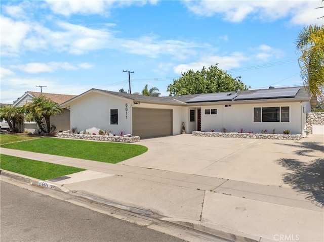 6611 Pickett Ave, Garden Grove, CA 92845 - single story home with an attached garage, stucco siding, driveway, a front lawn, and roof mounted solar panels