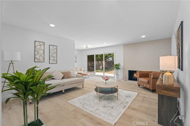 6611 Pickett Ave, Garden Grove, CA 92845 - living area with light wood-type flooring, recessed lighting, and a fireplace