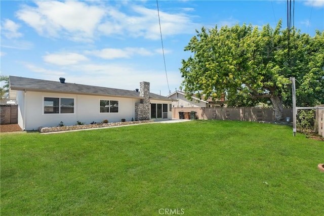 6611 Pickett Ave, Garden Grove, CA 92845 - back of house featuring a fenced backyard and stucco siding