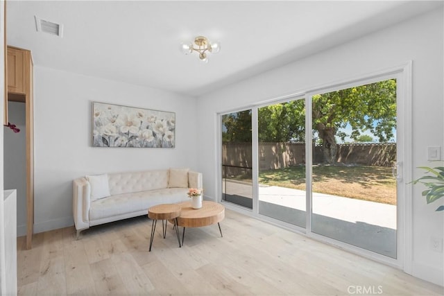 6611 Pickett Ave, Garden Grove, CA 92845 - living room with light wood finished floors and a chandelier