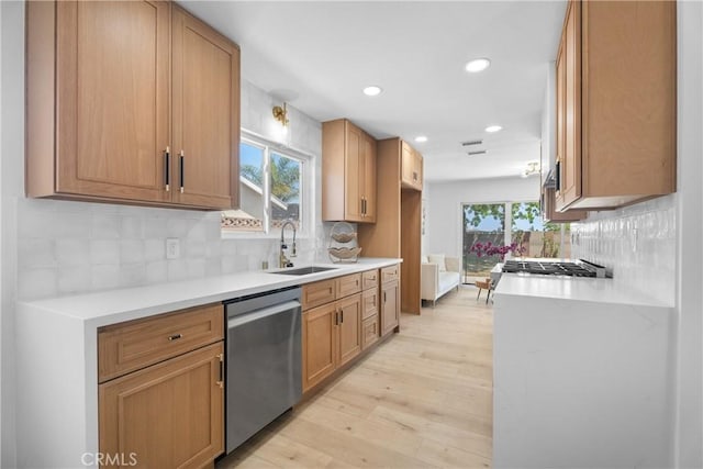 6611 Pickett Ave, Garden Grove, CA 92845 - kitchen with dishwasher, light wood finished floors, light countertops, backsplash, and recessed lighting