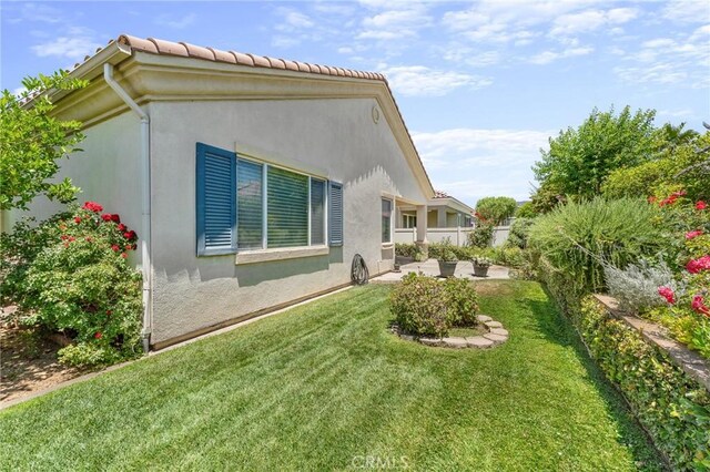 1790 N Forest Oaks Dr, Beaumont, CA 92223 - view of side of home with a patio area and stucco siding
