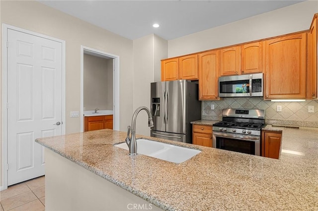 1790 N Forest Oaks Dr, Beaumont, CA 92223 - kitchen with appliances with stainless steel finishes, light stone counters, backsplash, light tile patterned floors, and recessed lighting