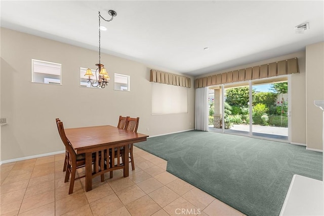 1790 N Forest Oaks Dr, Beaumont, CA 92223 - dining space featuring light carpet, light tile patterned floors, and a chandelier