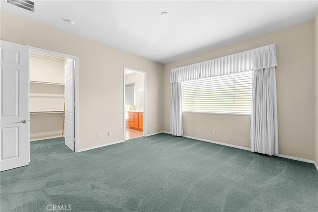 1790 N Forest Oaks Dr, Beaumont, CA 92223 - unfurnished bedroom with carpet flooring, a walk in closet, and connected bathroom