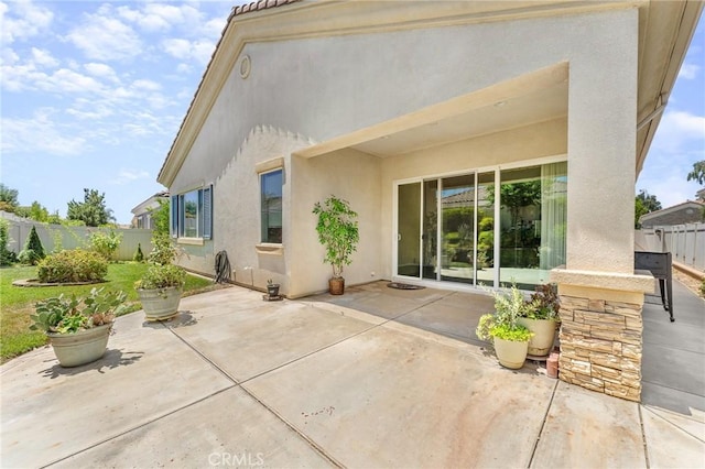 1790 N Forest Oaks Dr, Beaumont, CA 92223 - rear view of house featuring stucco siding and a patio area
