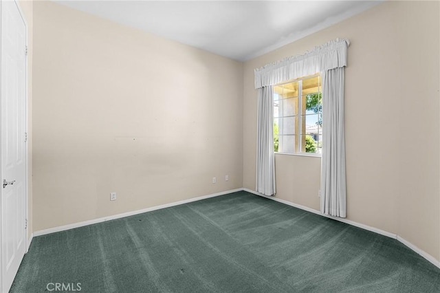 1790 N Forest Oaks Dr, Beaumont, CA 92223 - empty room with dark carpet and baseboards