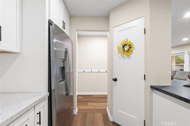 716 N Tulare Way, Upland, CA 91786 - kitchen with stainless steel fridge with ice dispenser, dark wood-type flooring, white cabinets, recessed lighting, and light stone countertops